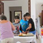 Yianni with his friends buying cakes from his Thea (Auntie) Trish